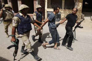 Security forces arrest a suspect in Kerdasah on the outskirts of Cairo