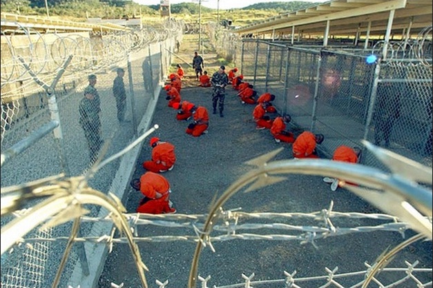 A photograph released on 11 January 2002 shows detainees accused of being Taliban and al-Qaida fighters in Guantánamo Bay prison. Photograph: Getty Images