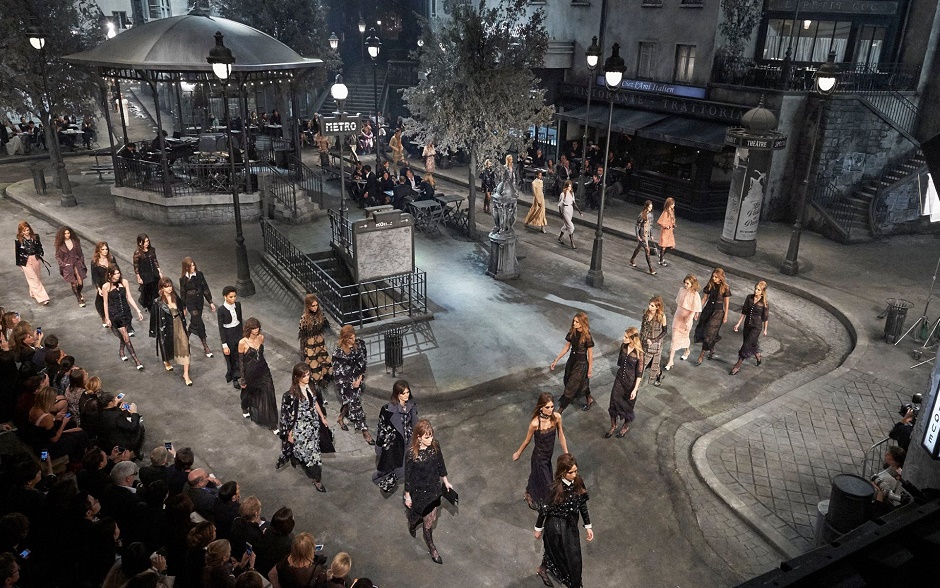 Rome's Cinecittà film studio became a bohemian portion of Paris for the evening as models bypassed guests sat on bistro chairs on a makeshift Parisian pavement