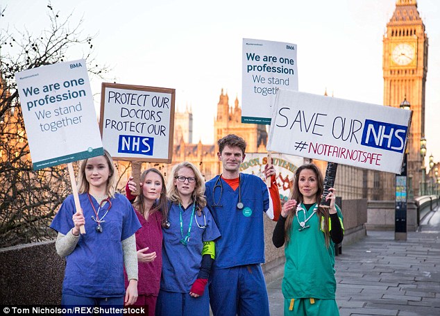 Doctors from St Thomas' Hospital in London wore their medical scrubs as they protested opposite UK Parliament.