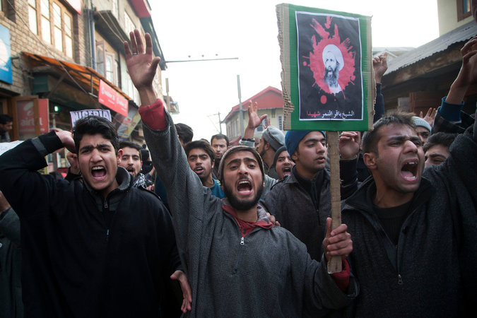 Shiites carrying a placard with an image of Sheikh Nimr al-Nimr at a protest in Srinagar, in the disputed region of Kashmir, on Saturday. Credit Dar Yasin/Associated Press