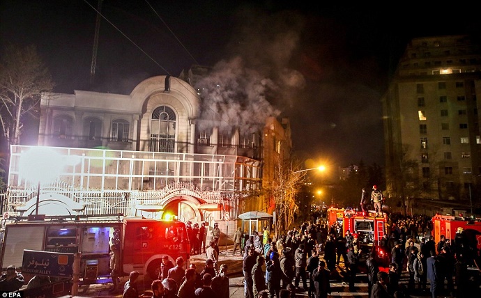 Firefighters arrive at the scene of the Saudi Arabian embassy which was torched by members of an angry mob in Tehran. Photo: EPA