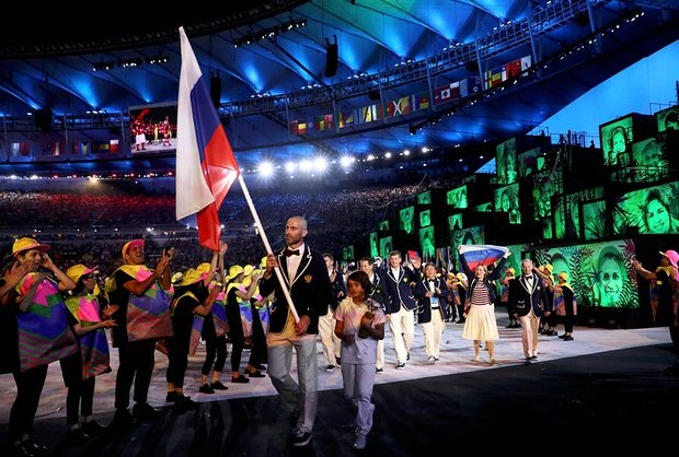 Sergey Tetyukhin leads out the Russian contingent to a comparatively muted welcome. Photograph: Stefan Wermuth/Reuters
