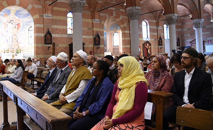 Members of the Muslim community attend a mass in the Catholic church of Santa Maria of Caravaggio on Sunday in Milan, Italy. Photo: Pier Marco Tacca/Getty Images