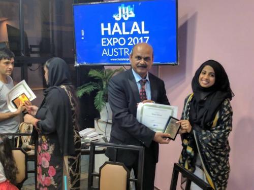 Rahaf Ahmad receiving Certificate of Appreciation and an Award