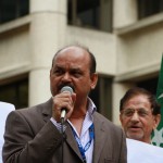 Syed Atiq ul Hassan speaking at the protest