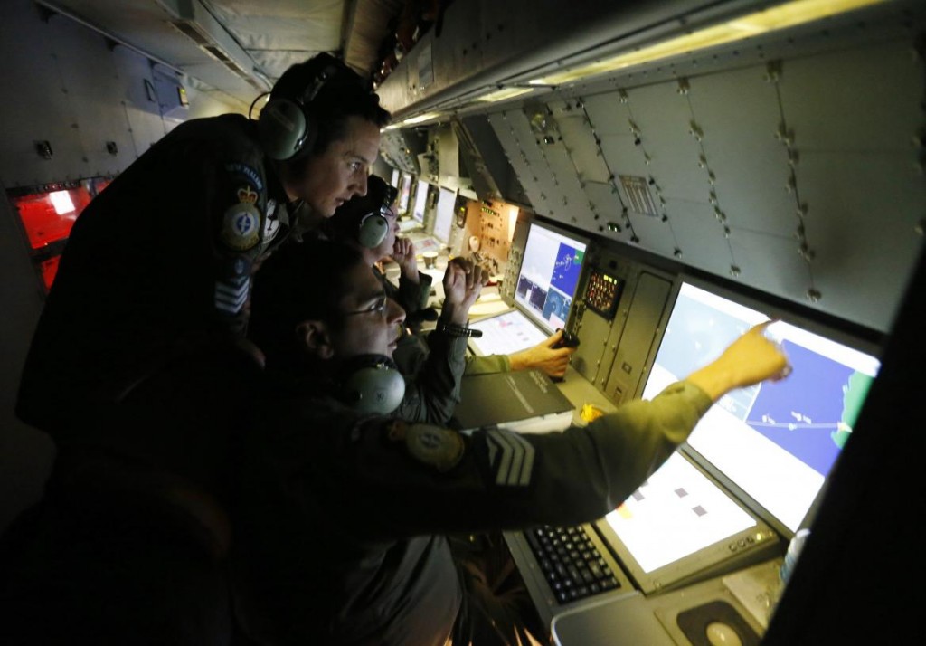 Radar specialists are pictured aboard a Royal New Zealand Air Force P-3K2 Orion aircraft searching for missing Malaysian Airlines flight MH370 over the southern Indian Ocean. (Reuters/Jason Reed)