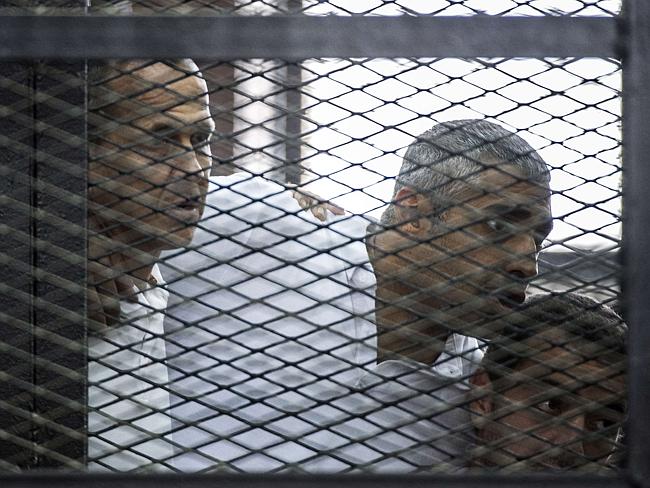 Imprisoned ... Australian journalist Peter Greste (left) and his colleagues, Egyptian-Canadian Mohamed Fadel Fahmy and Egyptian Baher Mohamed, at the police institute near Cairo's Tora prison on June 23, 2014. Picture: AFP/Khaled Desouki Source: AFP