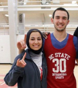 Deah Shaddy Barakat (right) and his wife Yusor at a recent UNC Basketball game. (From Barakat’s Facebook Page)