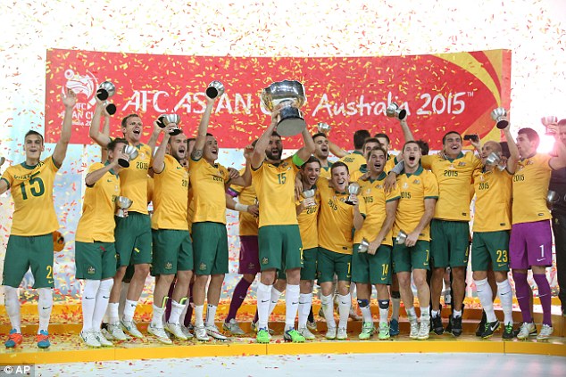 The Socceroos celebrate with the Asian Cup trophy after beating South Korea 2-1 in the final at Stadium Australia on January 31, 2015 in Sydney.