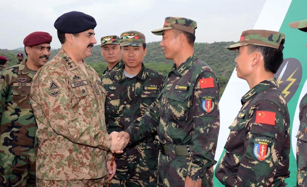 Chief of Army Staff General Raheel Sharif meeting a Chinese soldier during his visit to Pak-China special forces joint training exercise at Headquaters SSG near Cherat, Pakistan.