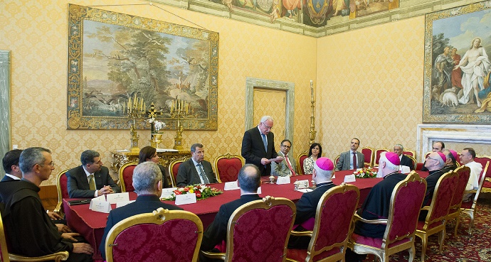 Palestinian Foreign Minister Riad al-Malki, standing, at a treaty-signing ceremony at the Vatican on Friday. Photo credit: L’Ossservatore Romano via AP