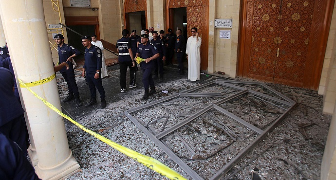 Kuwaiti security forces gather outside the Shiite Al-Imam al-Sadeq mosque after it was targeted by a suicide bombing during Friday prayers on June 26, 2015, in Kuwait City. Photo: Yasser Al-Zayyat/AFP via Getty Images