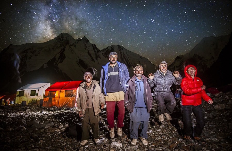 The porters photographed outside at base camp. They sometimes light fires using rubbish from the expeditions. PHOTO: DAVID KASZLIKOWSKI