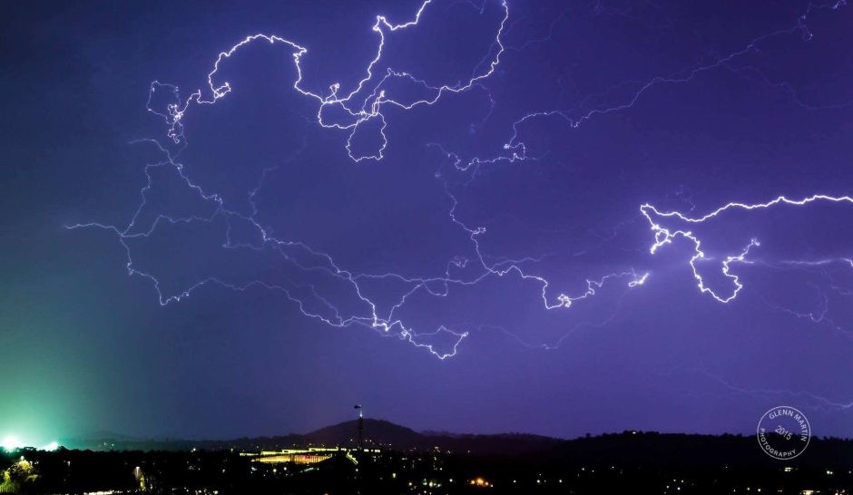 Lightning strikes "like silly string" over Parliament House. Photo: Glenn Martin