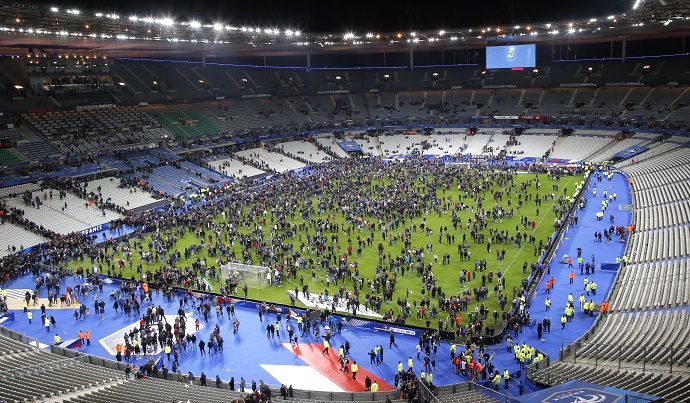 Spectators invade the pitch of the Stade de France stadium after the friendly soccer game between France and Germany, Friday, November 13, 2015, in Saint Denis, outside Paris. AP Photo/Michel Euler