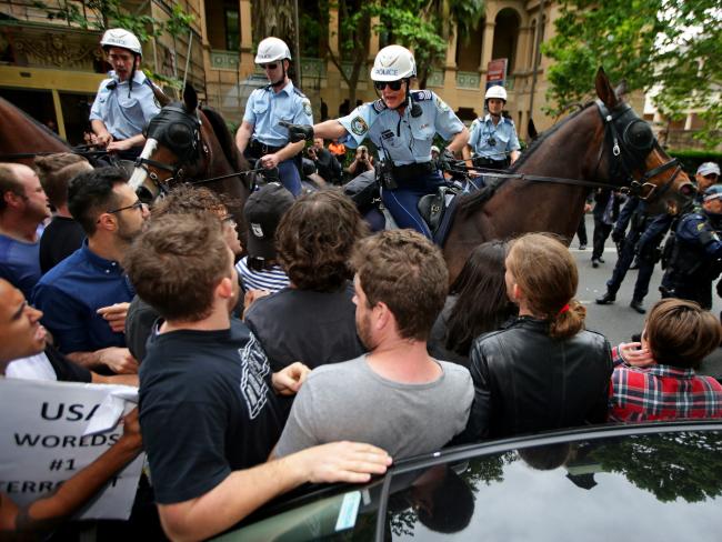 Protesters clash with police as they attempt to march down Macquarie Street in Sydney. Picture: Cameron Richardson