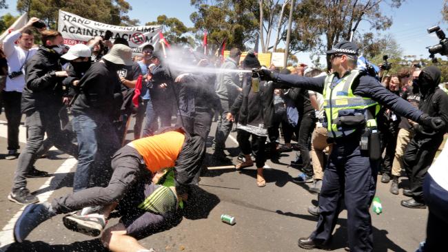 Riot police are forced to use pepper spray when a rally between Reclaim Australia protestors and anti-racism protesters turns violent in Victoria. Photo: Stuart McEvoy