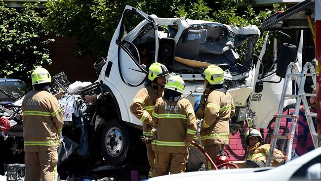 Firefighters at the crash scene on the corner of Barkly and Gordon streets. Photo Source:News Corp Australia