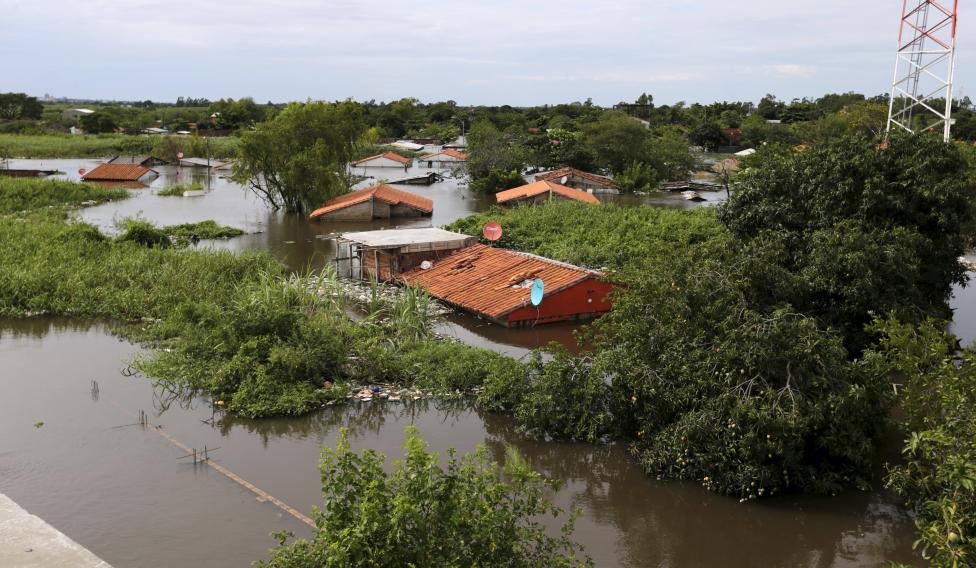 Houses are seen partially submerged in floodwaters in Asuncion, Paraguay. Photo Source: Reuters