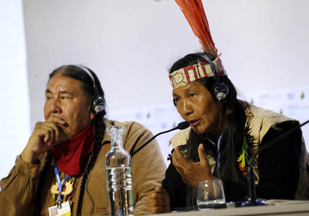 Protecting forests can mitigate the effects of worldwide climate change, indigenous leaders Tom B.K. Goldtooth of Bemjdji, Minnesota, left, and Gloria Hilda Ushiqua-Santi of the Ecuadorian Amazon rainforest stress at the United Nations Climate Change Conference in LeBourget, France, Tuesday. The conference continues until next week. (Photo: AP)