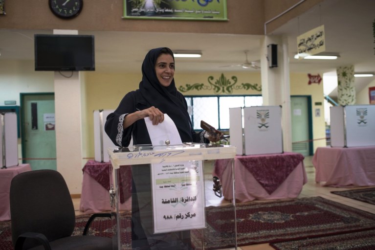 Lama Suliman, a candidate for a municipal seat, enters her vote in the ballot box in North Jeddah. MONIQUE JAQUES FOR THE WALL STREET JOURNAL 