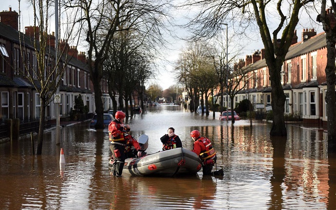 The emergency services prepare to rescue residents from a flooded street in Carlisle AFP/Getty