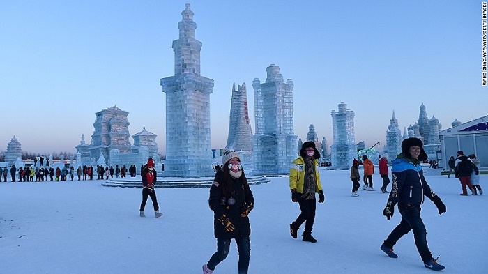 People visit the China Ice and Snow World on the eve of the opening ceremony of the Harbin International Ice and Snow Festival in Harbin, northeast China’s Heilongjiang province on January 4, 2016. (WANG ZHAO/AFP/Getty Images)