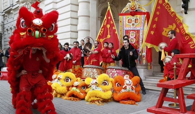 Members of the Pak Mei DE Lao Wei San Kung-Fu school perform to celebrate Chinese New Year in front of the Shangri-La hotel in Paris, France. (Reuters)