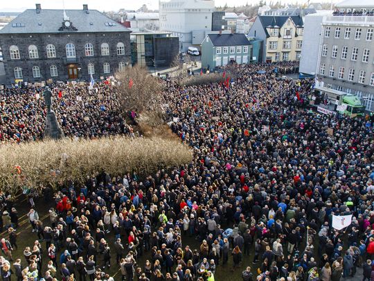 People gathered during a protest on Austurvollur Square in front of the Icelandic Parliament in Reykjavic, Iceland, on April 4, 2016. (Photo: Birgir Por Hardarson, EPA)