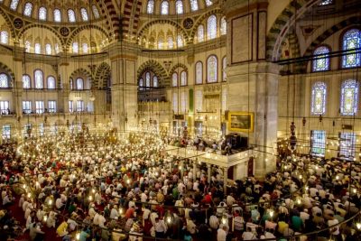 Turkish Muslims offer Eid al Fitr prayers as they mark the first day of the Eid al-Fitr at Fatih Sultan Mosque on July 5, 2016 in Istanbul. Photo: Chris McGrath/Getty Images