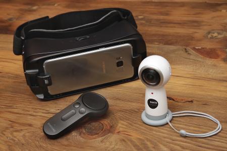 The new Samsung Gear 360 camera, right, Gear VR headset, and controller displayed during a preview in New York.